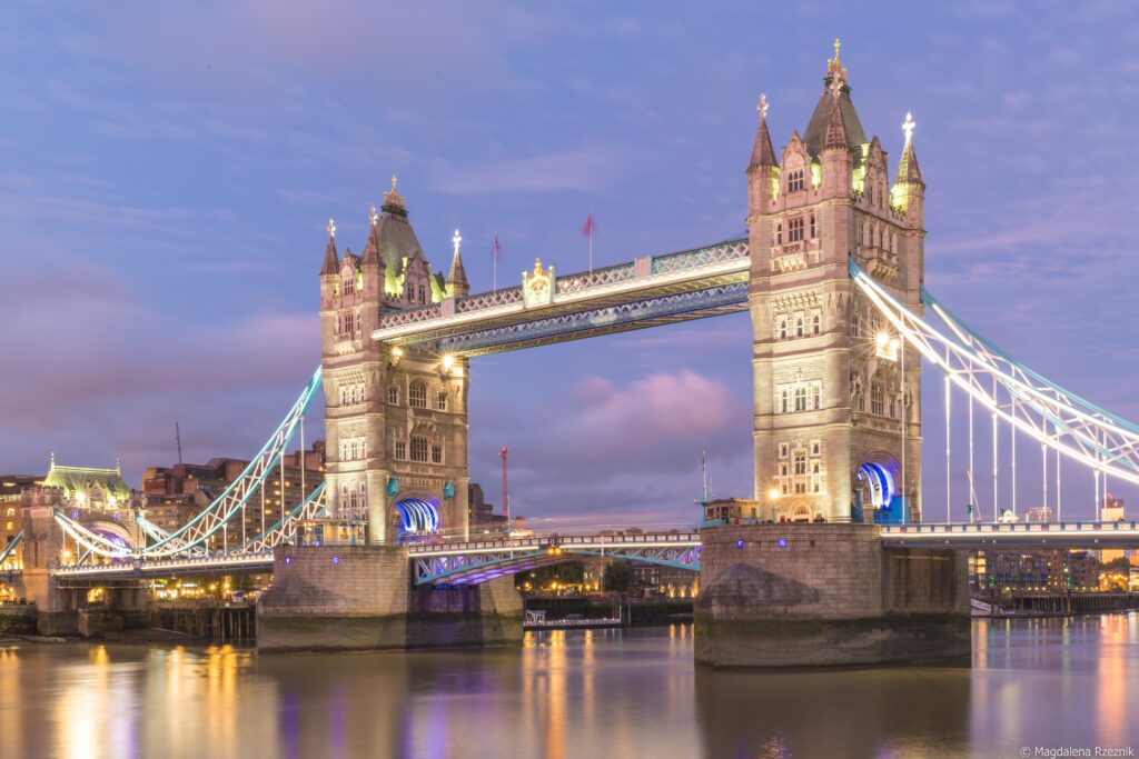 A low angle shot of the famous historic Tower Bridge in London during evening time
